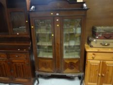 A vintage inlaid mahogany china cabinet with marquetry rail (distressed)