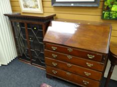 An antique mahogany sloped bureau with four drawers and a nice fitted internal arrangements of