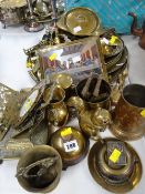 A parcel of mixed brassware including reception bell, platters, horse brasses etc