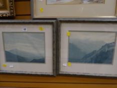 A pair of framed watercolours of Snowdonia by well known artist David Woodford (faded)