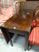 A nineteenth century drop leaf dining table