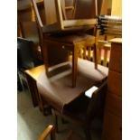 A retro drop leaf teak dining table and four chairs