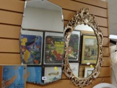 A fancy gilt framed oval mirror and two others