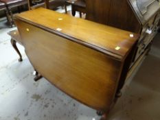 A mahogany effect drop leaf dining table