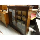 An antique two-door glazed bookcase cupboard top (no base) with internal shelves