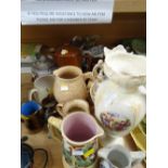 A quantity of pottery jugs, vases etc