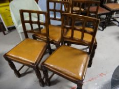 A set of four vintage X-back chairs with leatherette seats
