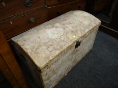 A covered vintage pine dome chest containing a large quantity of mixed fabric