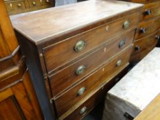 A nineteenth century chest of four graduated drawers (distressed)