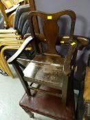 A single antique dining chair and a vintage child's chair