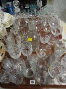 A large quantity of mixed drinking glasses etc