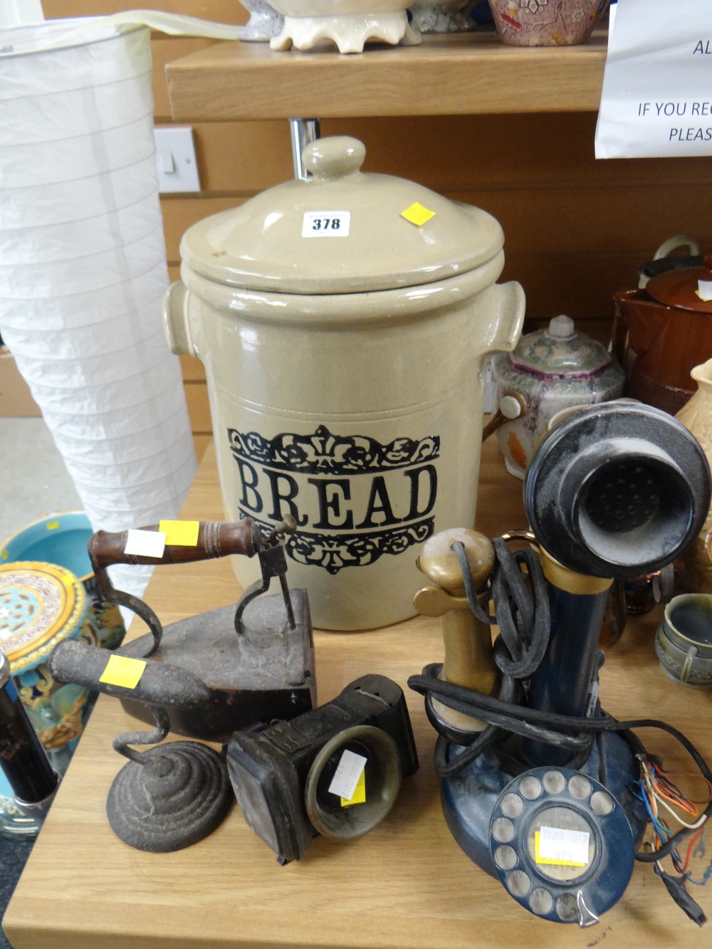 A stoneware bread bin, antique flat iron, retro telephone etc