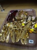 A quantity of yellow metal loose cutlery etc