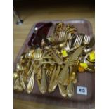 A quantity of yellow metal loose cutlery etc