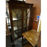 A vintage painted mahogany two-door standing china cabinet