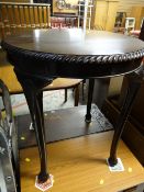 A nice quality mahogany circular occasional table on cabriole supports with carved shell detail