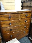 A bow front Victorian mahogany chest of three long and two short drawers