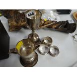 Two hallmarked English silver trophies on plinths and three silver napkins rings