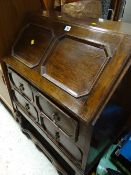 A vintage panelled two-drawer bureau