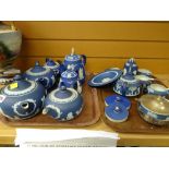 A quantity of blue Wedgwood Jasperware teapots and other items