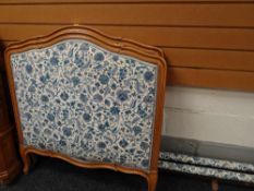 A pair of single lightwood and upholstered French bed ends