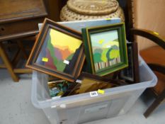 A tub of framed pictures etc