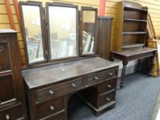 An antique mahogany side table and an open bow fronted bookcase