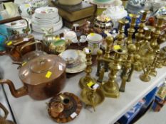 A quantity of brassware, mainly candlestick holders and three copper kettles etc