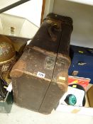 A vintage rigid banded suitcase