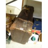 A vintage rigid banded suitcase