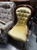 A reproduction buttoned spoon back chair