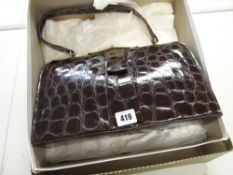 A vintage genuine crocodile skin handbag, retailed by The Martin, London, in original box