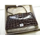 A vintage genuine crocodile skin handbag, retailed by The Martin, London, in original box