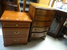 A Stag bedside chest of two long drawers and narrow top drawer together with a reproduction