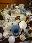 A tray of various china ornaments including moustache cups, Toby Jugs, Wedgwood Jasperware etc