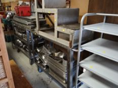 A large parcel of mainly stainless steel commercial kitchenware including serving trolleys, trays