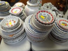 A large collection of various ribbon plates