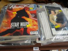 A selection of magazines promoting various Star Wars films together with a selection of movie star