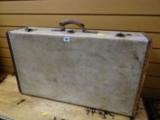 A vintage studded rigid suitcase