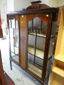 An Edwardian inlaid mahogany two-door standing china cabinet