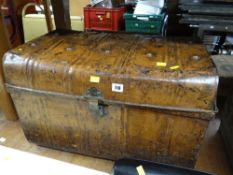 A vintage metal tin trunk