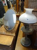 Green ceramic & brass effect based oil lamp together with a small swivel gilt metal toilet mirror