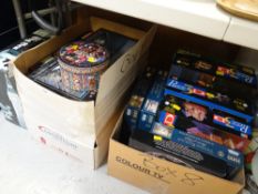 Two boxes of various jigsaw puzzles together with a Big Ben boxed puzzle and a folding table
