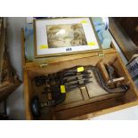 A boxed vintage drill & bits together with a small framed watercolour of a fishing boat on estuary