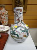 A Chinese baluster vase decorated with dragons