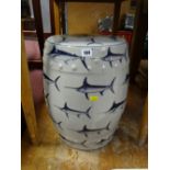 A ceramic barrel seat decorated with swordfish