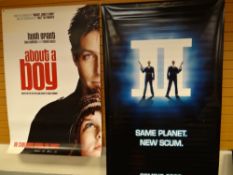 Four original cinema lobby wall hangs, including Men In Black 2, About a Boy, Johnny English & The