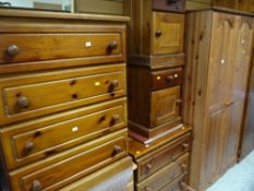 A pine double wardrobe, chest of four long drawers and another of three long drawers and a pair of