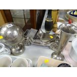 Three decorative brushed steel items, globe, motorcar and vase