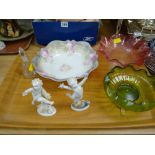 Two Meissen-style cherub figures, green glass bowl on gilt stand etc